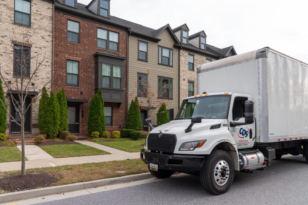 CDS Services - truck delivering to townhouses