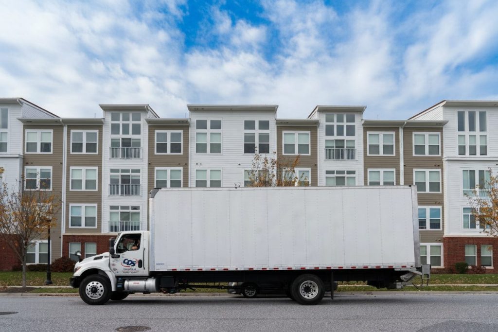 truck in front of multifamily