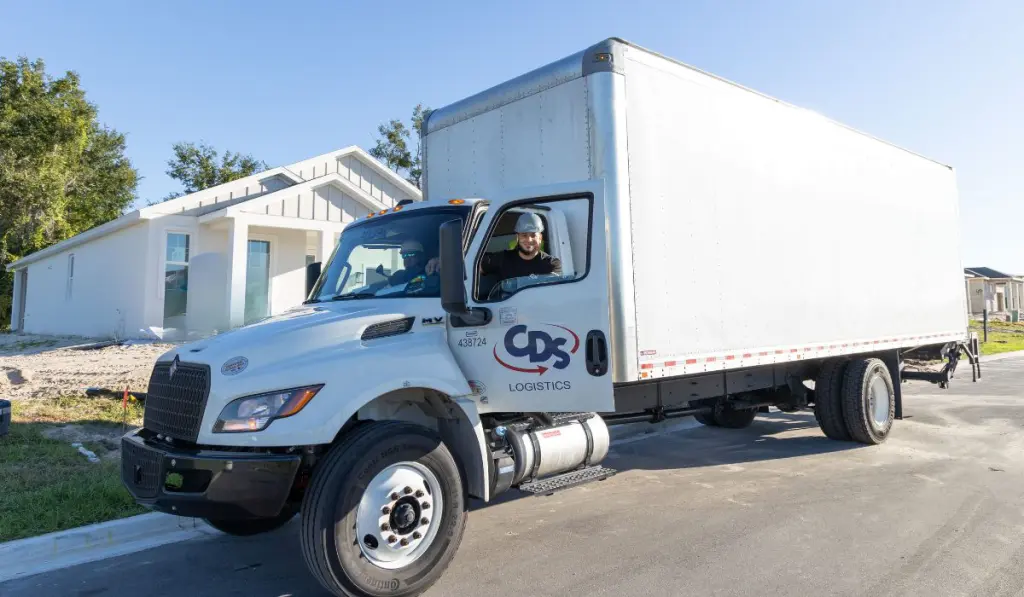 CDS Logistics last mile delivery service — two-person crew with delivery truck